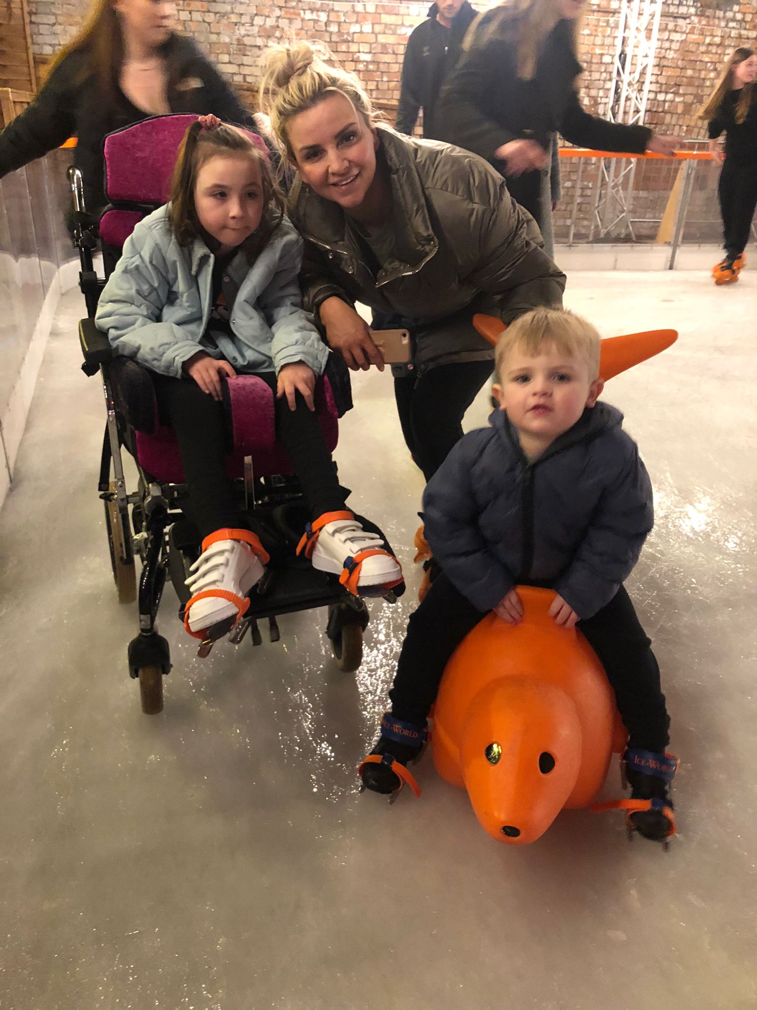 Heidi-Lou with mum Kate and three-year-old brother, Roux, on a recent ice-skating trip