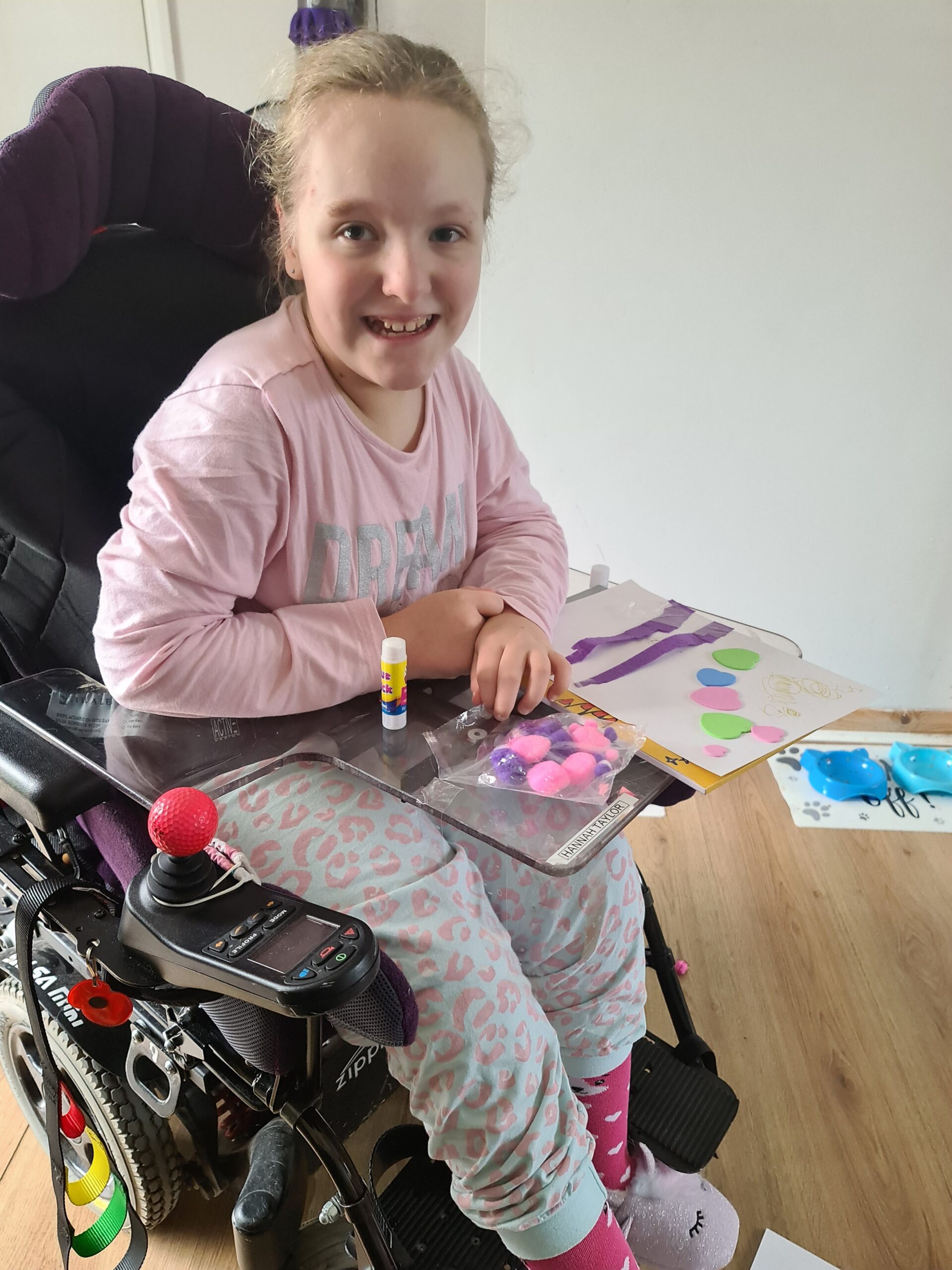 Hannah's trike is helping her to build her strength and muscle tone, which will help with transferring from her wheelchair